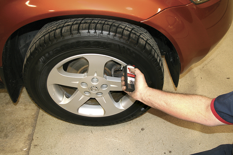 Place the tool on the tire near the transmitter and hold for five seconds.