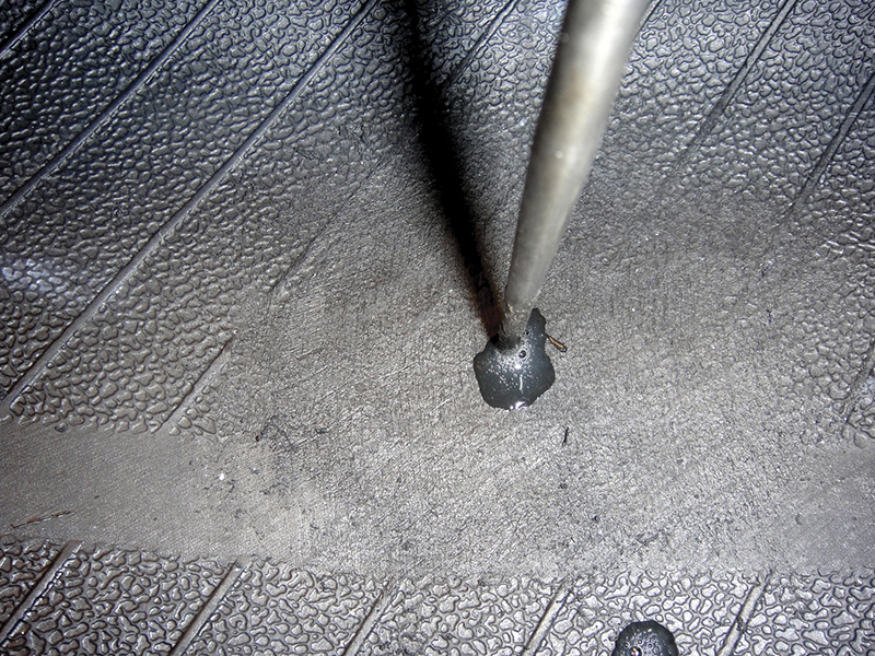 Use an awl to work vulcanizing cement into the channel.