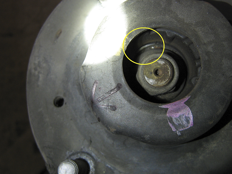 A careful visual examination will tell you a lot, such as how excessive motion has worn a “clean” spot on this strut top, which can be identified from under the hood.