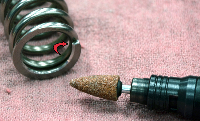 Pencil grinder and chamfered and radiused spring