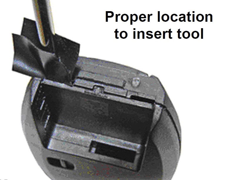 Remove the metal key insert, and use a plastic pry or electric tape-coated screw driver to separate the press-fit key halves.