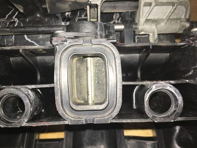 tangential-port-on-intake-manifold-with-swirl-pot-closed-after-soda-blasting