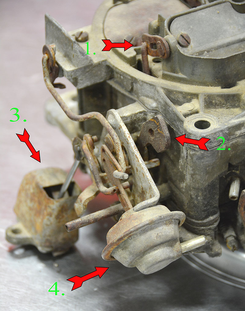 I rattled around in my parts bin and found this old girl for you. This is a remote choke Rochester Quadrajet carb. In this photo, I’ve numbered the offset choke valve operating linkage (1.), the fast idle cam (2.), the remote intake mounted choke thermostatic spring (3.), and the choke pull-off (4.). The remote-mounted choke coil relied on intake manifold heat crossover heat to unwind the coil and disengage the choke. Needless to say, a plugged crossover passage or inoperative heat rise system was often the problem, and unless you took the temperature of the crossover you’d go off chasing carb problems where none existed. If you ever need to check the crossover temperature, it runs about 100 degrees less than the right hand exhaust manifold temperature if you shoot both with an infrared thermometer. And now you know why fuel control is so hard on engines with heated intake systems. All that heat causes all sorts of percolation and hot fuel handling problems. 