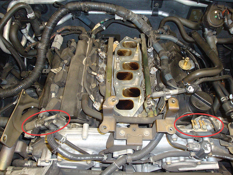 The intake valve timing (IVT) control solenoid valves are located on either side of the front of the engine block. The bank 1 IVT control solenoid valve is on the passenger side.