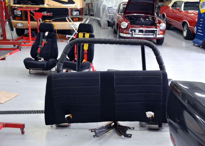 the-back-seat-was-cut-up-to-fit-roll-bar-and-front-bench-replaced-with-racing-seats-and-belts