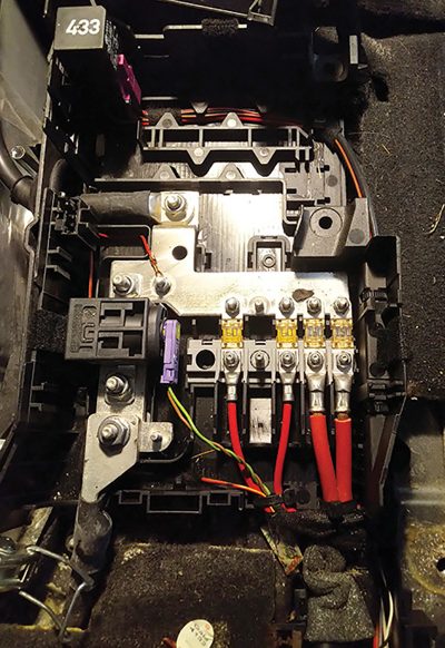 Fuse panel under driver seat